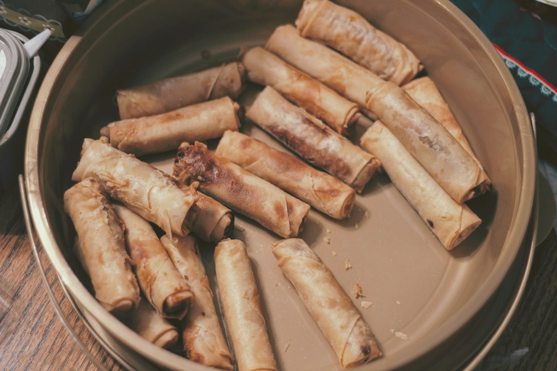 Fried spring rolls on a serving plate
